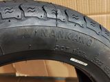 a close up of a tire on a cardboard box
