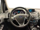 a steering wheel and dashboard of a car in a car showroom