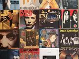 a lot of records on the wall of a room