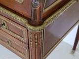 a wooden desk with a drawer on top of it