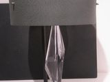 a lamp that is sitting on a table next to a wall