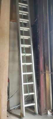 a ladder that is leaning against a wall in a room