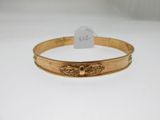a gold bracelet with a bee on the front of it