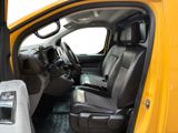 a yellow truck with black leather seats and a steering wheel