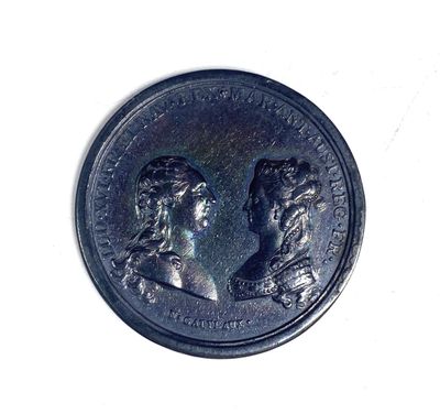 an image of a coin with two people on it