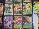 a lot of pokemon cards that are on the table
