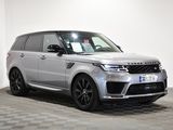 an image of a silver range rover parked in a garage