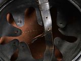 a close up of a helmet with a leather strap