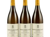 three bottles of chardon blanc wine on a white background
