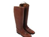 a pair of brown leather boots on a white background