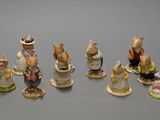 many figurines that are lined up on a table