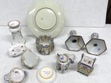 many pieces of porcelain sitting on a table