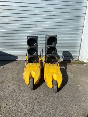 two yellow pedals that are sitting on the ground