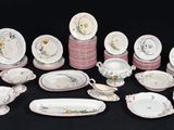 many different types of porcelain dishes and dishes on the table