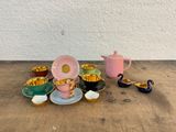 a lot of tea cups and saucers sitting on a table
