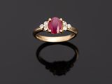 an oval ruby and diamond ring