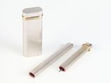 a lighter and a lighter case on a white surface