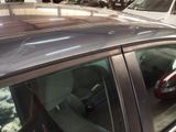 a car that is parked in a lot with other cars