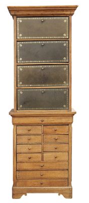 a tall wooden dresser with a glass door on top