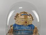 a glass dome with a gold crown on it