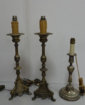 three candles that are sitting on a table