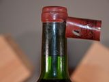 a bottle of wine that is sitting on a table