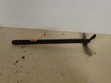 an image of a hammer on the floor next to a white wall