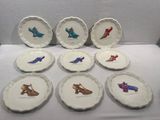 nine plates with different designs on them on a table