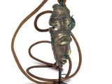 statue of a man holding a rope in his hand on a white background