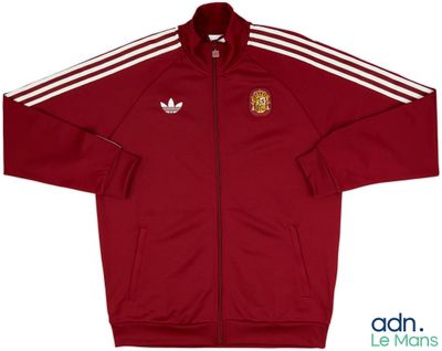 a red jacket with white stripes and a crest on the front