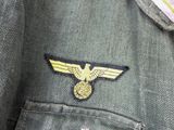 a military jacket with a gold eagle on it