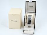 an image of a watch in a box on a white surface