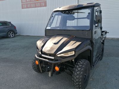 an image of a black utility vehicle parked in front of a building