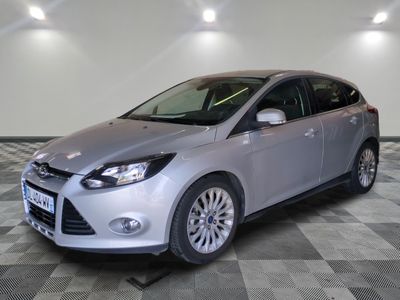 the ford focus is parked on a checkered floor in a garage