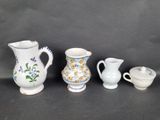 three different types of vases and a small bowl on a table