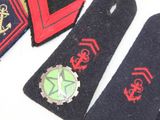 several different types of badges are displayed on a white surface
