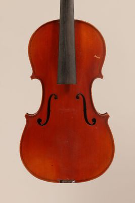 an old violin with a bow hanging from it ' s neck