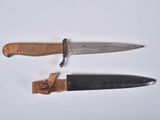 two knives that are laying next to each other on a table