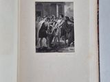 an open book with a black and white photo of a group of people