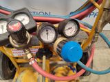 gauges and gauges on the side of a yellow machine