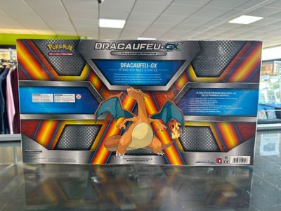 display case of a box of pokemon cards in a store