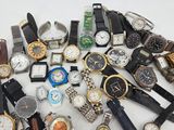 many different types of watches on a white surface