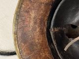 a close up of a helmet on a white surface
