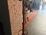an image of a coat rack with a hat on it