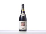 a close up of a bottle of wine on a table