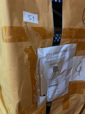a bag with a tie on it sitting on the floor