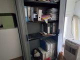 an image of a room with a lot of clutter on the floor