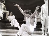 a black and white photo of a woman in a ballet pose