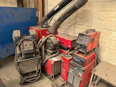 many different types of welding equipment in a garage