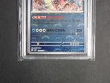 a close up of a card in a plastic case on a table